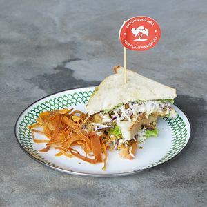 Tricken Sandwich: shredded tricken sandwich with fresh lettuce, tomato, vegan mayo, and sweet potato chips at Warung Dua Hati in Canggu