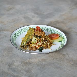 Mie Goreng Special: wok-fried noodle with vegan chicken, greens, topped with crispy kale chips at Warung Dua Hati in Canggu