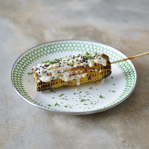 Grilled Corn on the Cob (GF): served with your choice of vegan BBQ sauce or garlic aioli sauce at Warung Dua Hati in Canggu