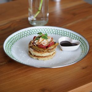 Pancakes: topped with strawberries, caramelized banana, and coconut nectar at Warung Dua Hati in Canggu