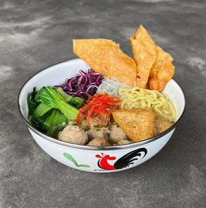 Vegan Meatball Soup: vegan meatball soup with tofu, noodle, vermicelli, cabbage, greens, and fried wontons at Warung Dua Hati in Canggu