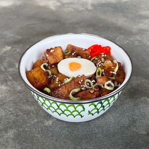 Sweet Soy Vegan Pork Rice Bowl: braised vegan pork and potatoes in sweet soy sauce, topped with vegan boiled egg, scallions, and fresh red chilies at Warung Dua Hati in Canggu