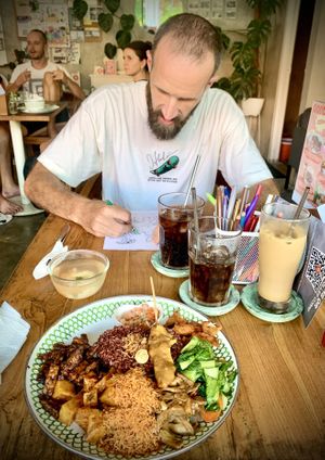 Nasi campur and entertainment 🦖🖍️  at Warung Dua Hati in Canggu