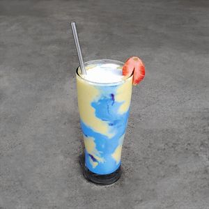 Blue Spirulina Smoothie
Blue spirulina, plant-based protein powder, mango, pineapple, cucumber, banana, almond milk, and coconut milk, topped with sliced strawberry at Warung Dua Hati in Canggu