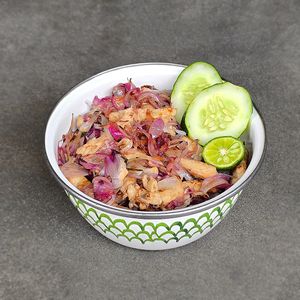 Balinese Matah "Chicken" Bowl: pan-seared “chicken” in fragrant sambal matah, shallots, lemongrass, lime leaves, white or red rice, topped with key lime and cucumber at Warung Dua Hati in Canggu