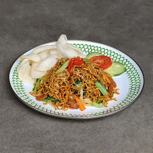 Fried Noodles / Mie Goreng: wok-fried noodles with vegan protein, veggies, topped with crackers at Warung Dua Hati in Canggu