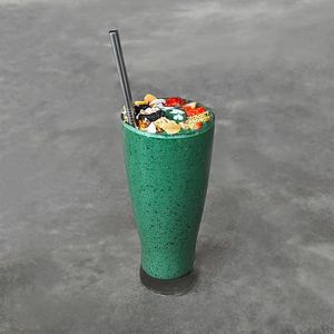Green Spirulina Protein Smoothie (GFO): green spirulina, plant-based protein powder, banana, mixed berries, kale, spinach, cucumber, and soy milk, with strawberry and granola at Warung Dua Hati in Canggu