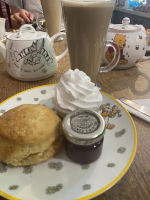 ‚Cream tea’ set which includes scones, coconut whipped cream, jam and chosen hot drink  at Pooh Corner in Hartfield