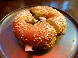 Fresh bagel with cream cheese and warm mushrooms at Coffee Place in Tbilisi