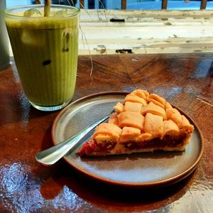 Strawberry pie and iced matcha latte at Coffee Place in Tbilisi