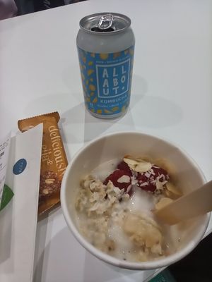 Stopped for breakfast here on 15/4/23. Coconut Milk loaded porridge with raspberries, bananas, almonds, coconut and chia seeds. Irish kombucha brand. Just as nice as before. at DUB - Nomad - T1 in Dublin