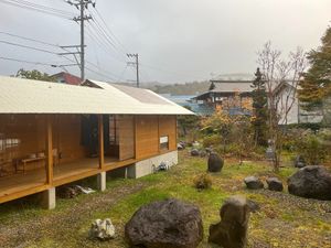 garden and hallway to the private hot spring bath. at Yuzaka - Natural & Sustainable Inn in Kazuno