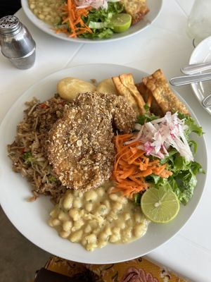Broster de soya, arepitas fritas, arroz chaufa, fresol, tequeños y ensalada fresca  at Noqa Vegan in Lima