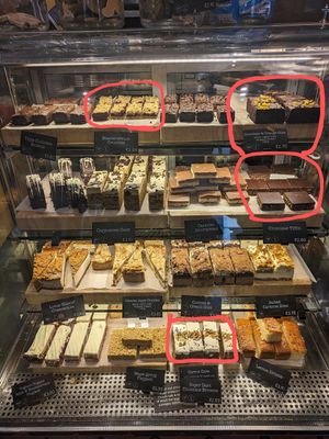 Vegan Cake Options - blackcurrant crumble, chocolate and orange cake, chocolate tiffin, carrot cake at Coffee #1 - Bath City Centre in Bath