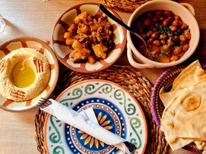Hummous, potatoes, fava beans and lebanese bread at Hommus Como in Como