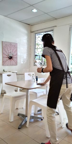 Staff wiping table with eco-friendly product at The Leaf 绿叶坊 - Georgetown in Penang