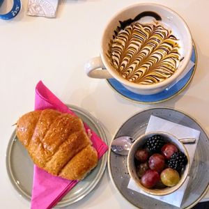 Colazione vegan con macedonia, maxi cappuccino di soia, croissant vuoto at Caffè Letterario in Ravenna