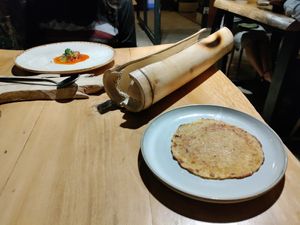Plantain cassava pancake and inside the tube, a small tamal at Diacá in Guatemala City