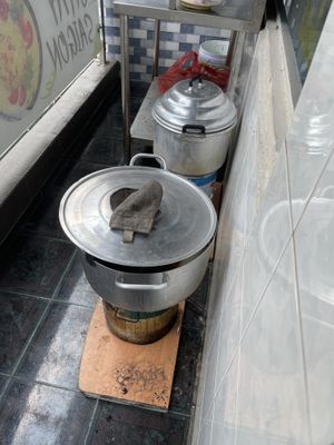 Cooking over charcoal on the balcony   at Chay Saigon Bistro in Ho Chi Minh City