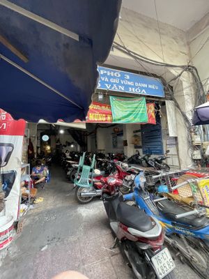 Go into this parking lot then up the stairs on the left   at Chay Saigon Bistro in Ho Chi Minh City