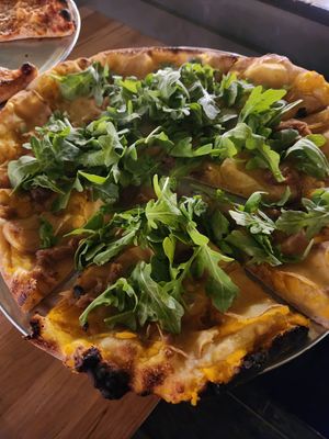 Arugula, potatoes, caramelized onions, butternut squash sauce. at Cushnoc Brewing Co in Augusta