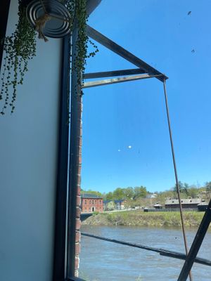 View of the Kennebec out the rear windows! at Cushnoc Brewing Co in Augusta