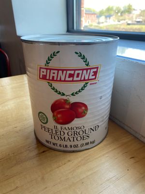 6lb can of tomatoes on every table  at Cushnoc Brewing Co in Augusta