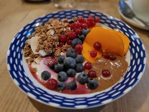 Granola with coconut yoghurt, almond butter, and fresh fruits and berries at Håndbakt in Oslo
