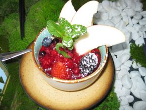 Dessert "ERDE AUS FERNOST" on a nicely decorated table at Secret Garden in Munich