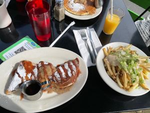 Vegan stuffed French toast, vegan cheesy fries, and vegan pancakes at Veggie Galaxy in Cambridge