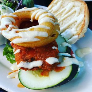 Spicy chikn burger with a nice big onion ring   at Veggie Galaxy in Cambridge
