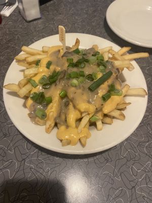 Vegan poutine, 3.5/5. More like cheese fries—which isn’t bad, just not what we expected! Also the cheese had a bit of a mustard taste which I didn’t love. Still good though!  at Veggie Galaxy in Cambridge