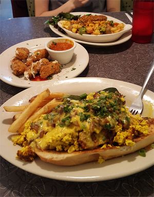 Vegan mac and cheese, vegan mozzarella sticks, tofu scramble over toasted bread at Veggie Galaxy in Cambridge