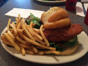 Chicken sandwich with onion rings and fries. at Veggie Galaxy in Cambridge