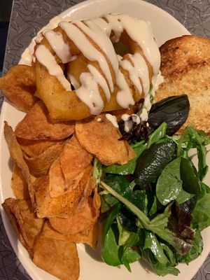 Buffalo Chick’n sandwich topped with onion rings  at Veggie Galaxy in Cambridge