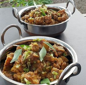Soy Free Tempeh Curry cooked with potatoes, cauliflower in a coconut milk curry paste at Spoon and Sprout in Houston