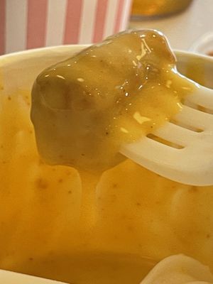 Tot dipped in cheese   at Neat Burger - Bishopsgate in London