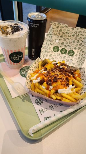 Loaded fries, Oreo shake, sparkling water at Neat Burger - Bishopsgate in London