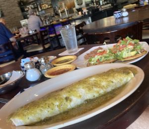Giant veggie burrito- hold the dairy plus verde on the top. Very good !  at Maria Cuca's Mexican Cuisine in Keller