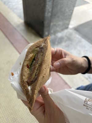 vegan sandwich with hummus, mint, eggplant, bell pepper, tomato, and soy mayo  at TRAME' in Milan