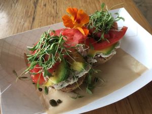 Veggie bagel with cashew cheese, avacado, tomato and sprouts.  at Maui Kombucha in Haiku