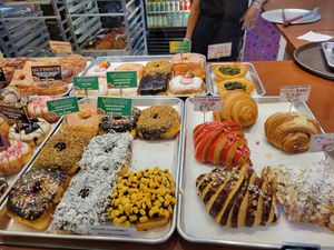Vegan Donuts selection, Vegan Spinach quiche, Vegan plain croissant. at Pink Love Donuts and More in Miami Beach