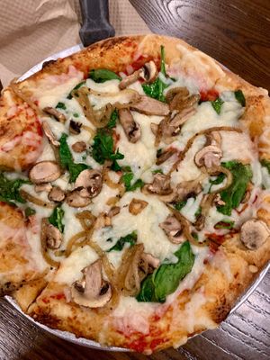 Create your own with vegan cheese, mushrooms, spinach, and onions. They told me the mushroom medley isn’t vegan because of the butter so you have to get the regular mushrooms. at Mellow Mushroom in Savannah
