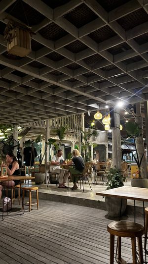Restaurant view from the swings   at Burgreens Canggu - Healthy Plant-Based Eatery in Canggu