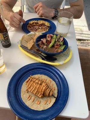 Aguachiles in the middle with fried stuffed jalapeños taco on the bottom  at La PlantisquerÍa in Mexico City