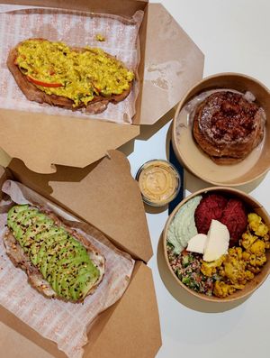 Delivery: shashuka toastie, avocado toastie, rainbow bowl, sumac strawberry pancake at Terra's Table in Riyadh