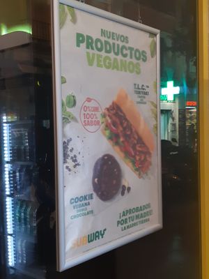 Signs advertising their vegan options at Subway in Madrid