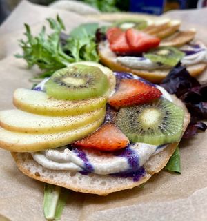 House made gluten free sough dough bagel with house made macadamia ricotta and fruit  at Botanika Cafe in Ridgefield