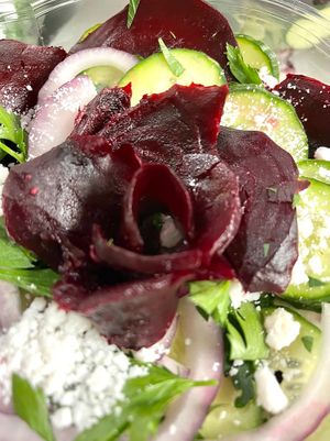 Beet salad with cucumber, red onion, feta, green leaves and simple dressing  at Botanika Cafe in Ridgefield