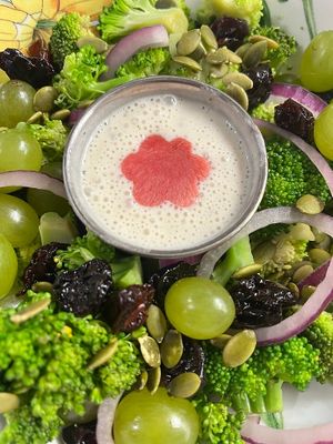 Broccoli Grape salad with dry cherry, pumpkin seeds, green leaves and cashew dressing  at Botanika Cafe in Ridgefield